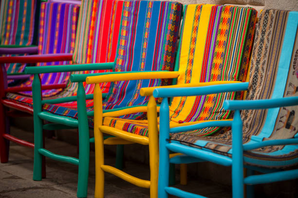 Colorful Peruvian Chairs Handmade Colorful Peruvian Chairs in a Row chinchero district stock pictures, royalty-free photos & images