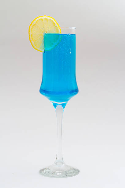 istock Wineglass with blue liquid and lemon 181404358