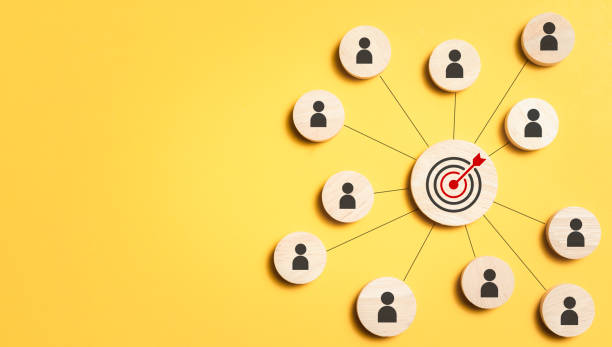 istock Customer relationship management concept. wooden block with target icon linked with human icons for customer focus group. Data exchanges development and customer service. 1814044048