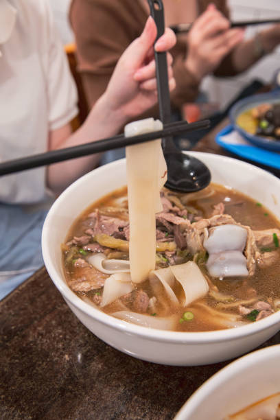 istock Hunan Rice Noodles Lifted with Chopsticks 1814044223