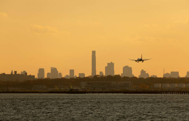 Airplane Landing in NYC stock photo
