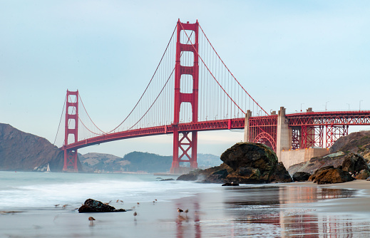 View of the Golden Gate Bridge in San Francisco, from the beach in daylight