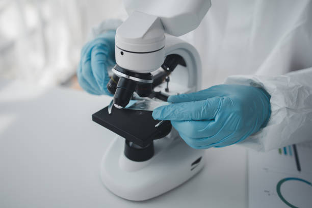 istock Lab practitioner working on chemical research for chemical reactions, does a chemical experiment and examines a patient's blood sample. Medicine and research concept. 1814089398