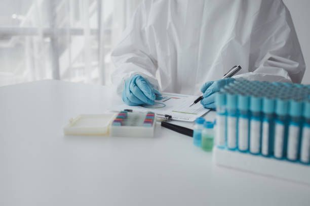 istock Lab practitioner working on chemical research for chemical reactions, does a chemical experiment and examines a patient's blood sample. Medicine and research concept. 1814091440