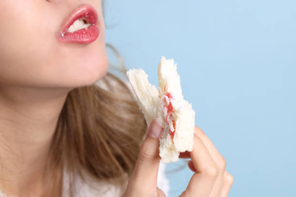 istock Woman Eating Food 1814123084
