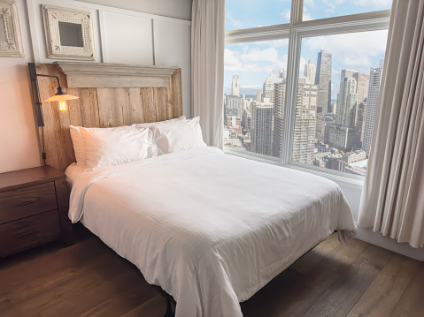 Bedroom with image montaged city view