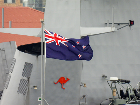Australian flag on a white pole.