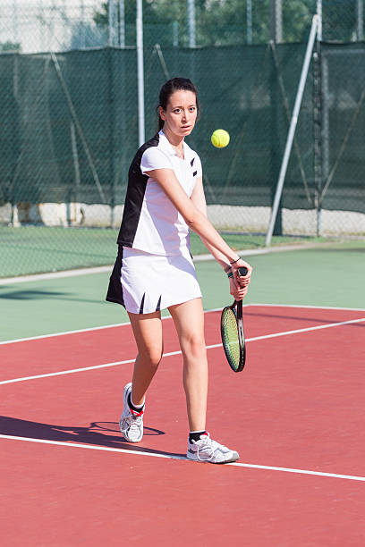 istock Young Woman Playing Tennis 181417087
