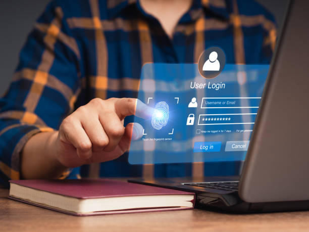 istock Log in to the system with a fingerprint on the virtual screen from a laptop 1814171695
