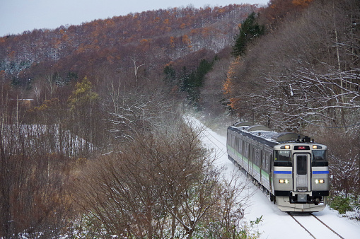 Otaru-city, Hokkaido, Japan - November 26, 2023 : KIHA 201 Rapid train “Niseko Liner” running on Hakodate line
