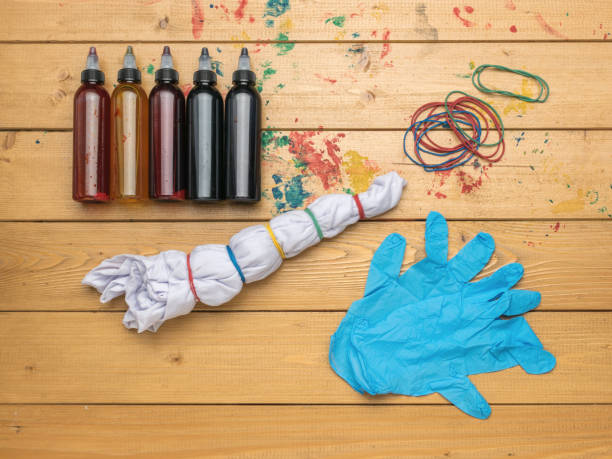istock The process of preparing to apply a tie dye pattern on a white T-shirt. 1814180415
