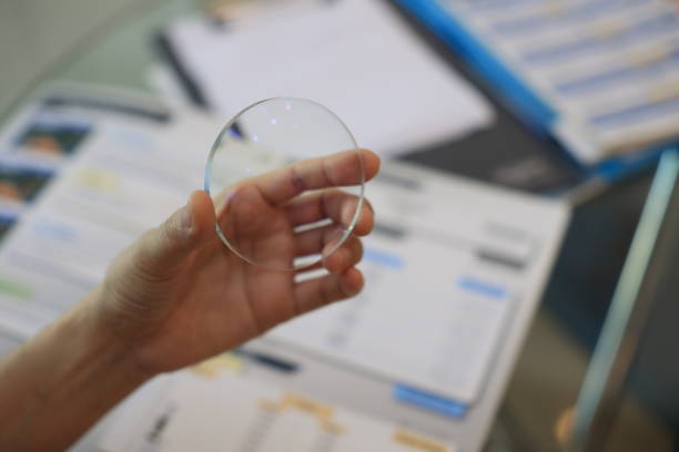 istock Hand holding glasses lens, lens glasses in hand 1814185875