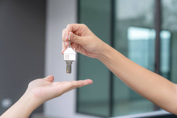 istock Hand receiving keys from new own property 1814185911