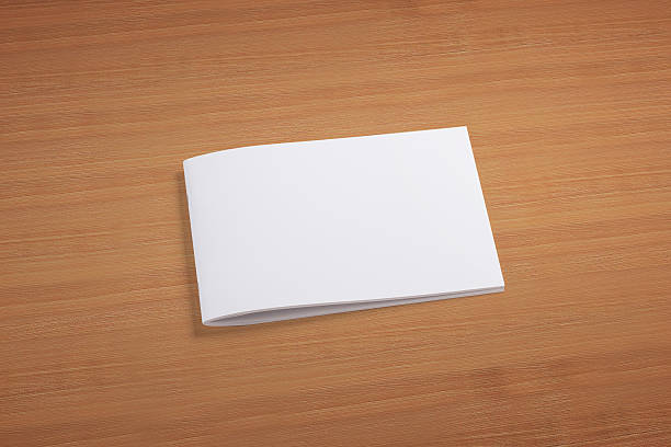 istock Blank closed magazine on wooden background 181422322