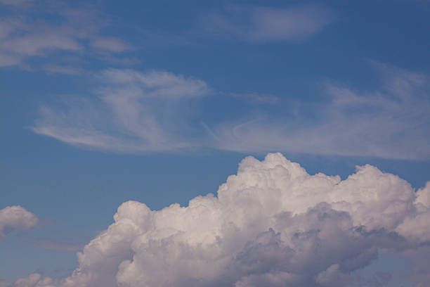 Cirrus and cumulonimbus clouds stock photo