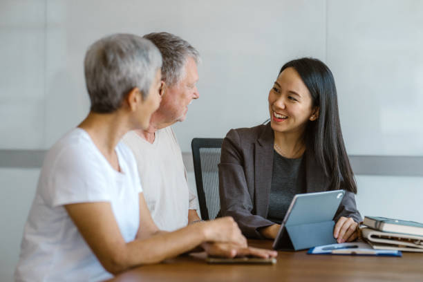 istock Success Sealed: Real Estate Agent Wraps Up Deal with Ecstatic Couple 1814247415