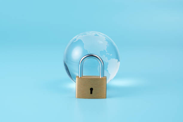 istock glass globe and key on blue background 1814280395