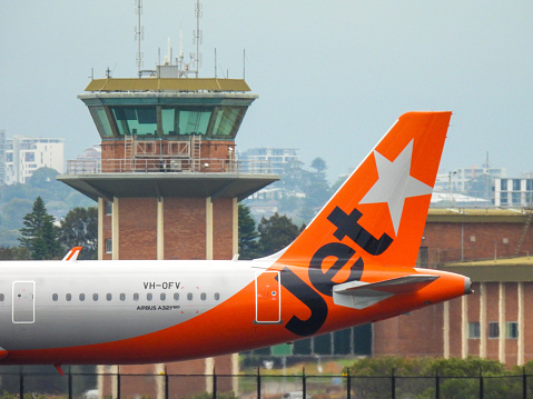 Naples, Italy - August 2019: Tail fin and winglet of an Easyjet Airbus A320 at Naples airport. Winglets improve an aircraft's fuel efficiency.