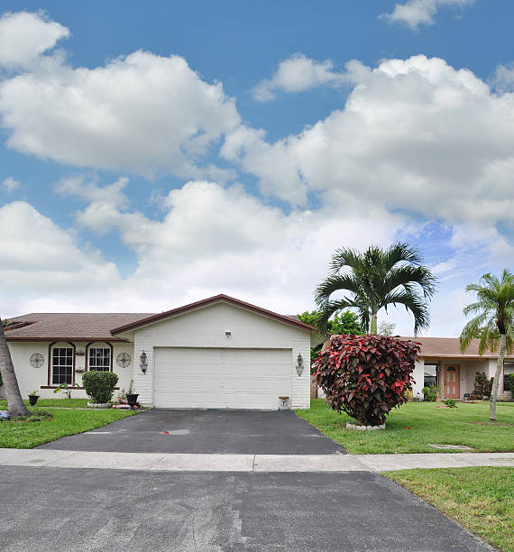 istock Suburban Home Garage Driveway Red Elm Bush 181430086
