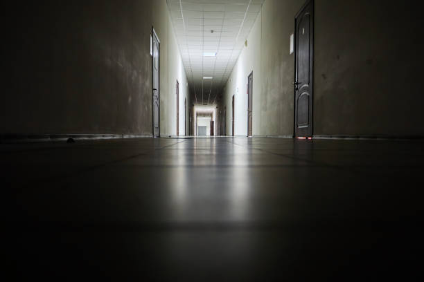 istock Corridor of an office building with poor lighting 1814302986
