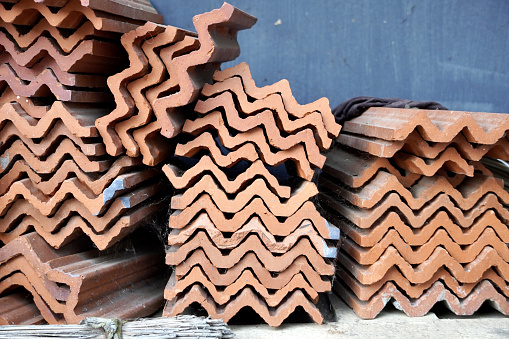 Roofing clay tiles for construction work.