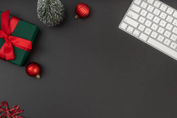 istock Home office table with Christmas decorations, keyboard. Flat lay, top view. Christmas workspace. 1814305141