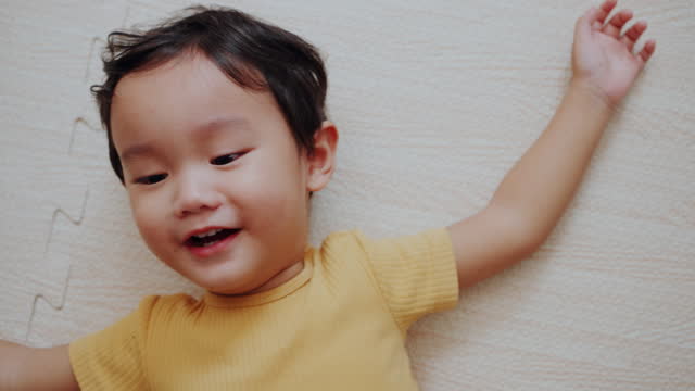 Joyful Innocence: Peekaboo Delight with a Happy Baby