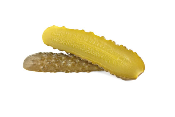 istock One pickled cucumber cut in half on white background 1814308814