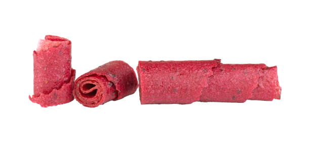 istock Delicious healthy fruit roll-ups isolated on a white background. Fruit pastille slices. 1814308829