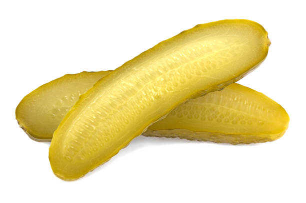 istock Marinated pickled cucumbers isolated on a white background. Pickled cucumbers and slices. 1814308834