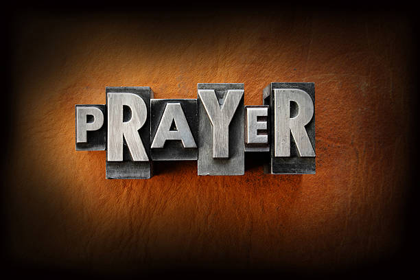 istock The word prayer in gray letters on a brown wall 181431075