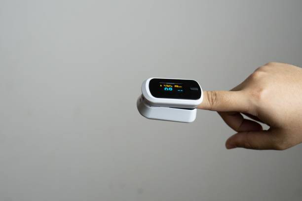 istock Close up of human finger while using Pulse Oximetry isolated on white background. 1814315083