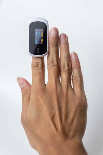 istock Close up of human finger while using Pulse Oximetry isolated on white background. 1814316659