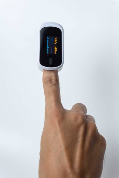 istock Close up of human finger while using Pulse Oximetry isolated on white background. 1814317182