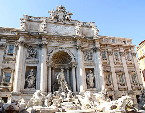 Photo of Fountain of trevi in Rome center with marble statues