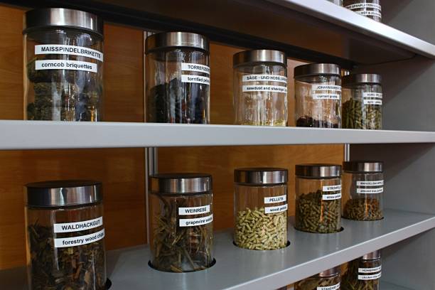 istock Various fuel types for wood gasification boilers, displayed in glass jars. 1814335317