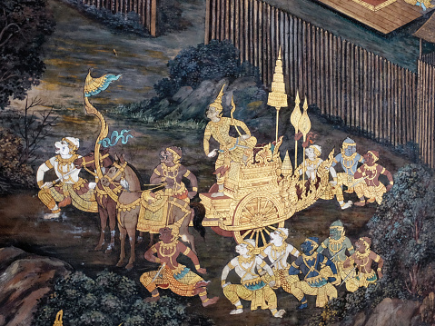 Bangkok, Thailand, December 27, 2018. Inside a Thai temple, a traditional mural painting recounts a captivating battle scene, reflecting the mythical tales of an ancient Indian epic.