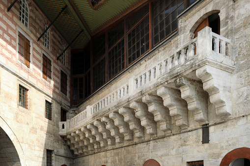 Beautiful stone balcony in the historical part of the city. Arabic architecture of the Byzantine period.