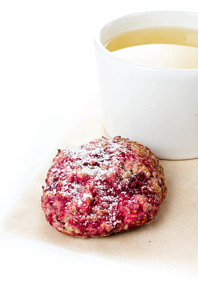 istock Raspberry cookie with oatmeal and cup of green tea 181437259