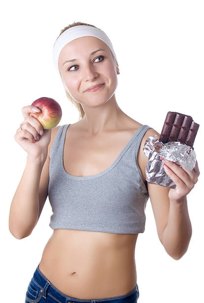 istock Young woman having a food dilemma 181437333