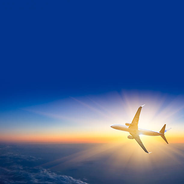 istock Airplane flying above earth in to sun 181441126