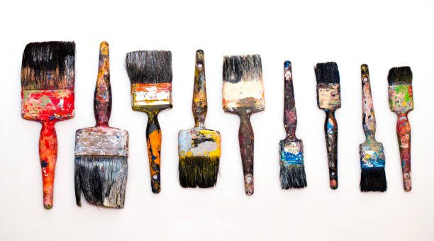 istock brushes in paints on a white background 1814412326