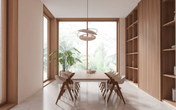 istock Stylish living room interior with table and seats, shelf and panoramic window 1814418711