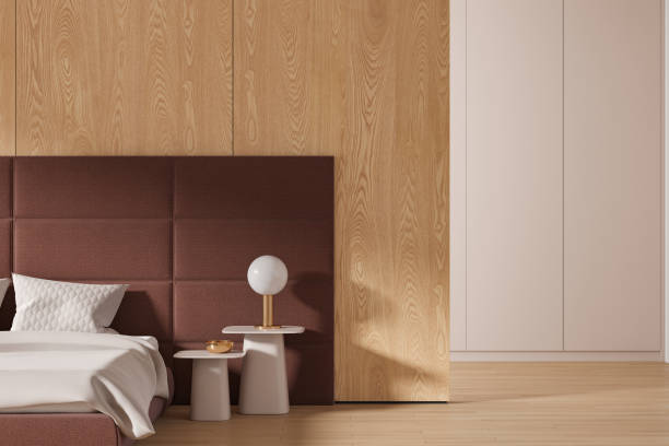 istock Modern hotel bedroom interior with bed, nightstand and wall partition 1814419230