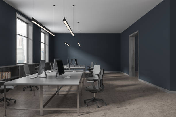 istock Dark office interior with desk and armchairs in row, door and panoramic window 1814431948