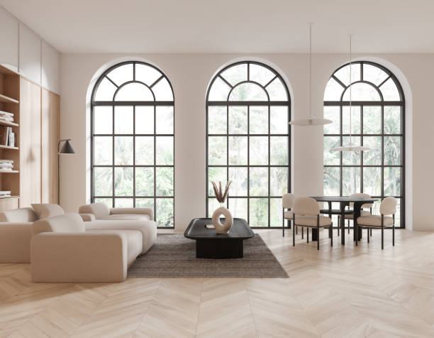 istock White home living room interior with eating table and couch, panoramic window 1814434671