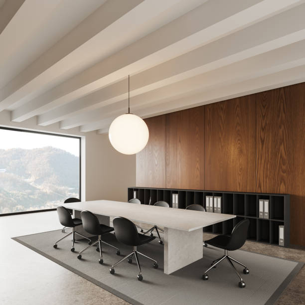 istock Modern office meeting room interior with table and chairs, shelf and window 1814437812