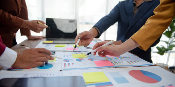 istock Business people meeting at office writing notes about sticky notes Laptop,tablet  Planning and Brainstorming Strategies of Colleagues in office 1814438343