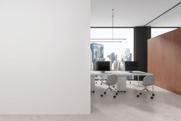 istock Cozy office interior with pc desktop on table and panoramic window. Mock up wall 1814441518