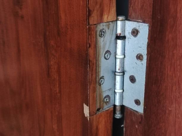 istock The Door Hinges Are Damaged And Rusty 1814470608